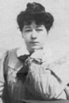 alice in writing smock