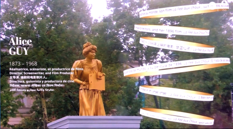 Screen Grab of Golden statue of Alice risign from Seine River with animated rings with text